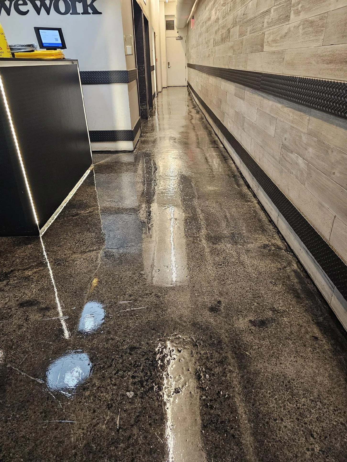 The same corridor floor with its polished finish after maintenance